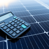 Calculator placed on solar panel calculating solar energy savings and installation cost